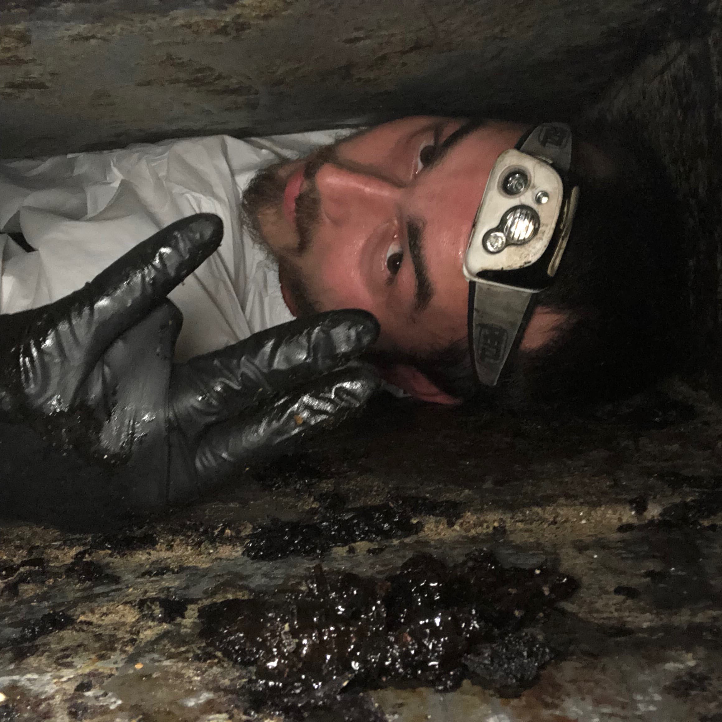 Bryan Exhaust technician inside a grease duct on a kitchen exhaust cleaning job