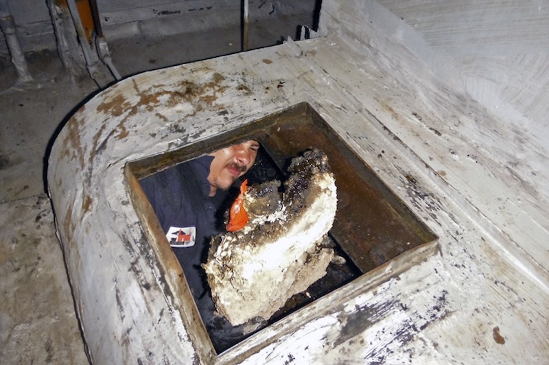 Removing a chunk of grease from a commercial kitchen exhaust system in Los Angeles