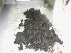 Large pile of grease removed from kitchen exhaust system during hood cleaning in San Pedro, Los Angeles