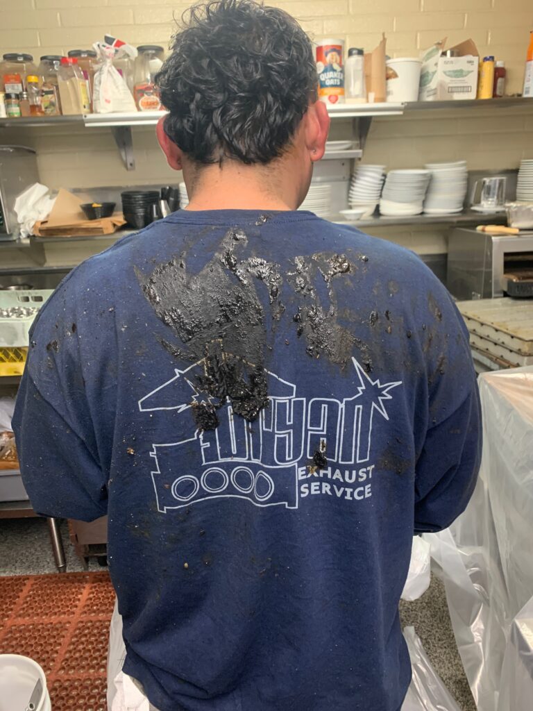 what on of our techs looked like after a successful kitchen exhaust cleaning in Long Beach