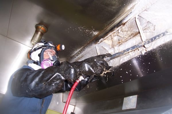 Man doing a restaurant hood cleaning in San Diego