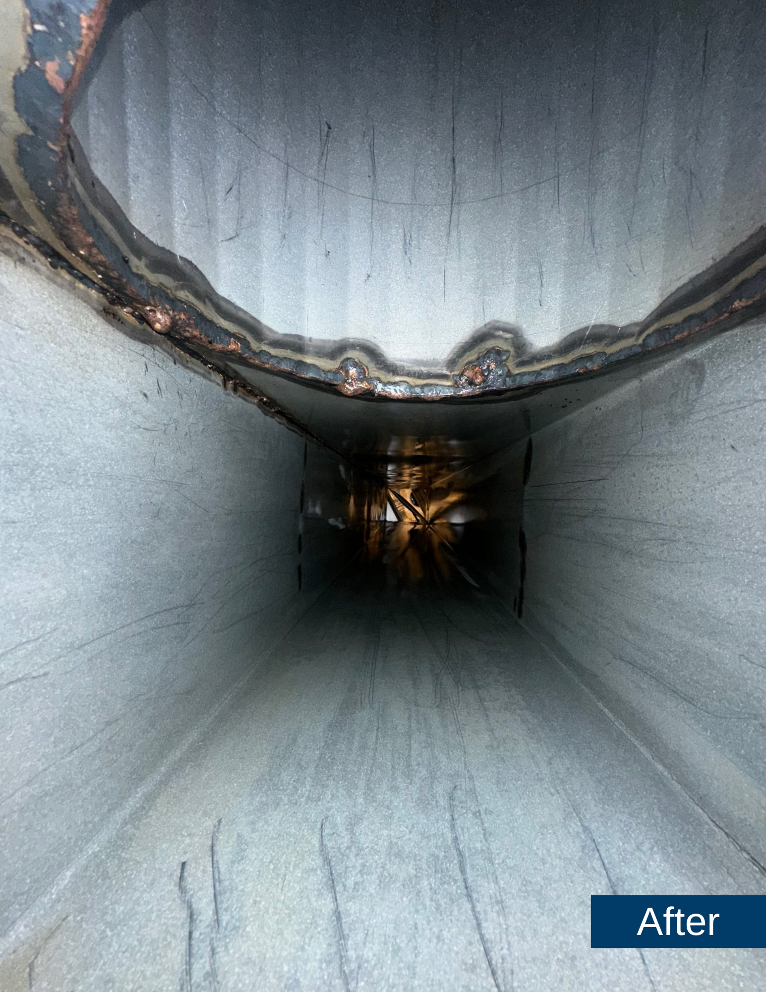 Cleaned kitchen exhaust duct interior showcasing smooth surfaces and clear visibility, demonstrating effective grease and dirt removal by Bryan Exhaust Service.